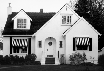 house with striped awnings