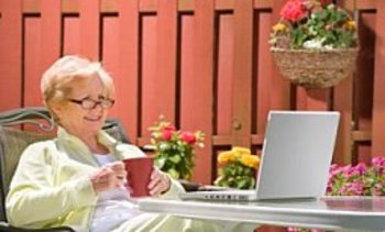 Senior adult woman working on computer