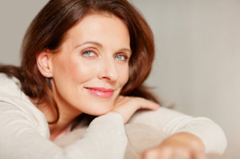 Portrait of a happy woman relaxing on couch