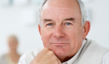 Closeup portrait of a retired man with hand on chin