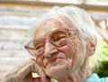Very old woman telling a joke