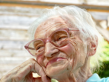 Very old woman telling a joke