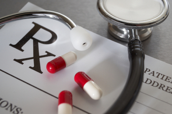 Close-up of RX prescription and stethoscope