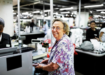 elderly woman grinning at the supermarket