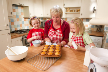 Grandmother and Girls Baking Cupcakes