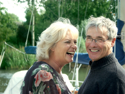 happy retired couple on a boat