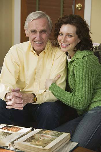 father-daughter-looking-at-photo-album