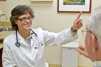 Dr-Gibbs-with-patient