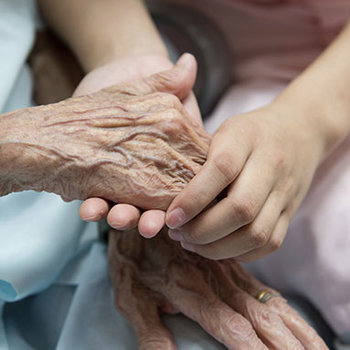 old-and-young-touching-hands